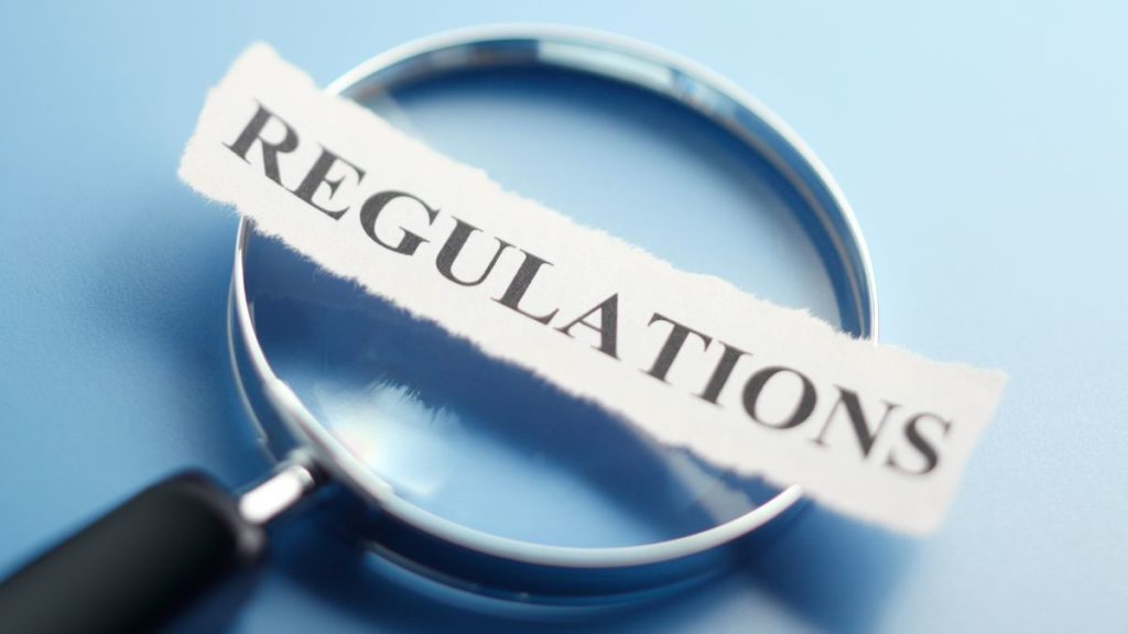 Crypto regulations magnifying glass